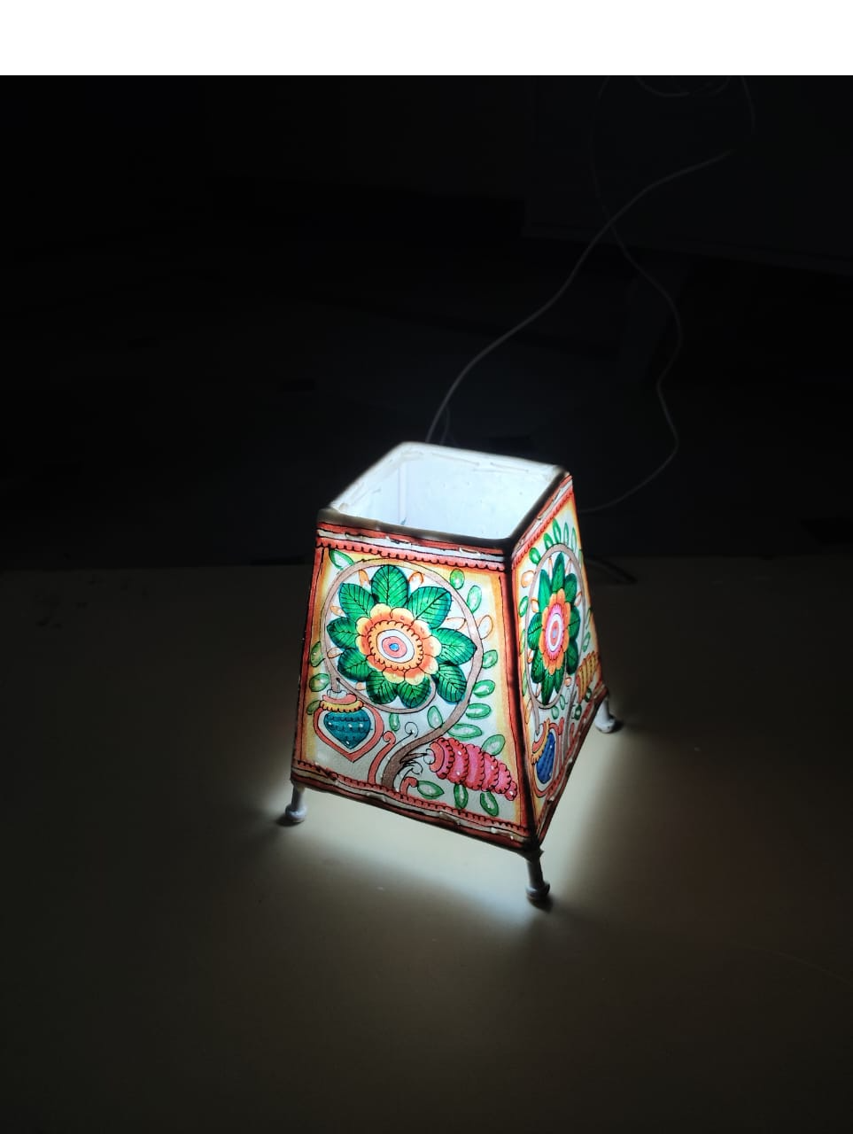 Hand-painted leather lampshades from India's GI-protected Tholu Bommalata craft tradition.