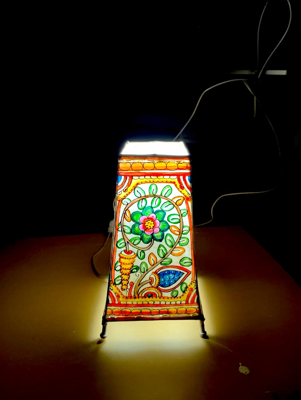Hand-painted leather lampshades from India's GI-protected Tholu Bommalata craft tradition.